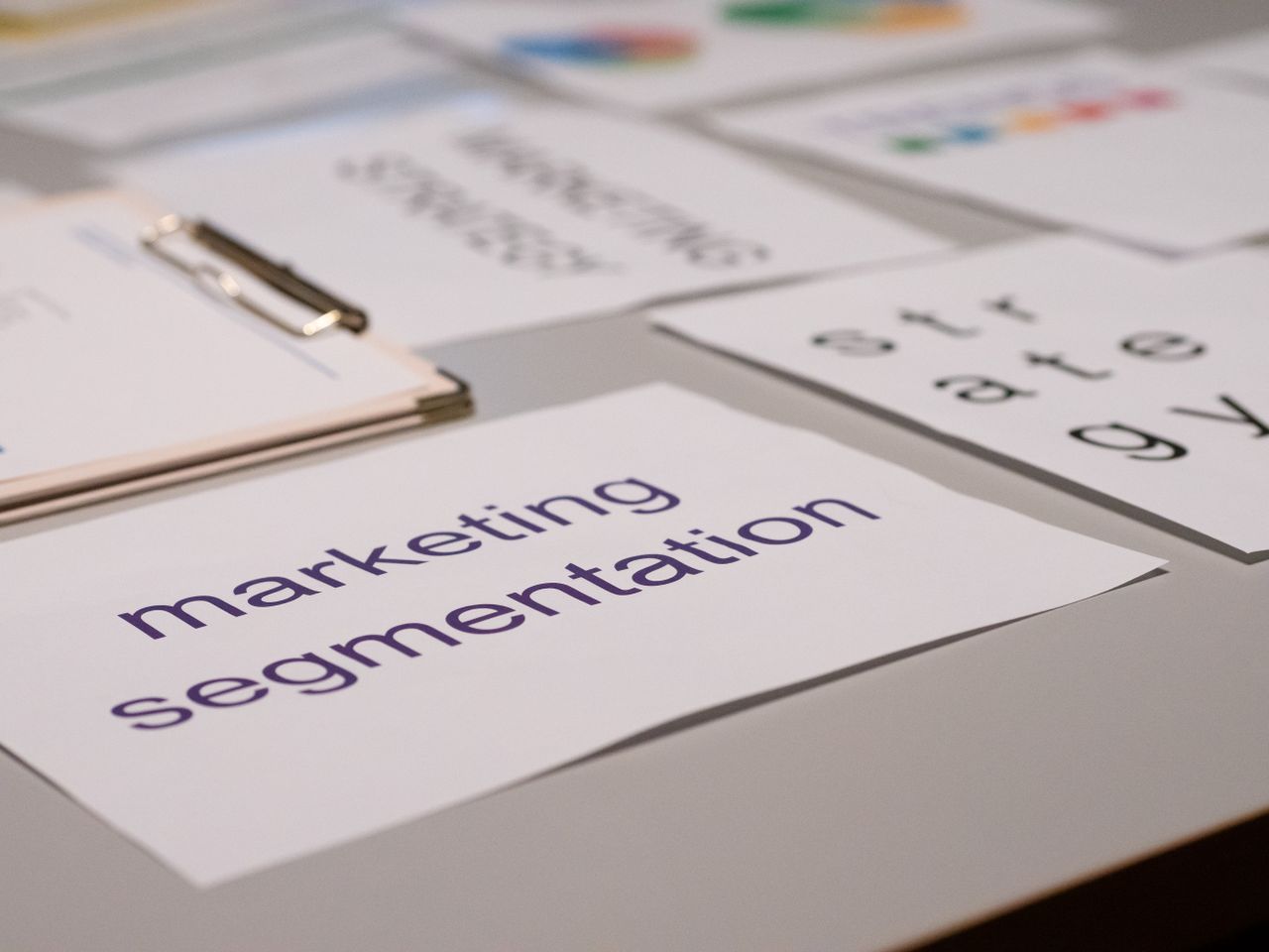 who-we-are Close-up of various marketing documents on a desk, perfect for business and strategy discussions.